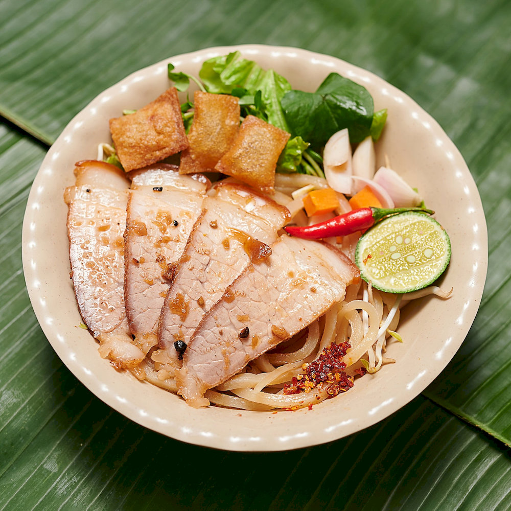 Diners often praise its balance of textures and say it’s one of the most iconic bowls of Cao Lau in town